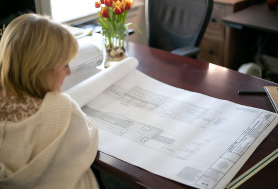Wanda looking over house plans